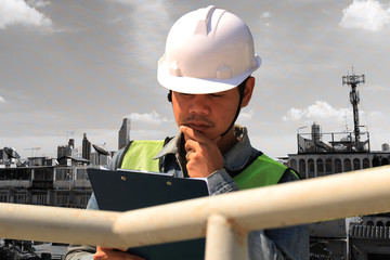 Construction workers holding boards to write work