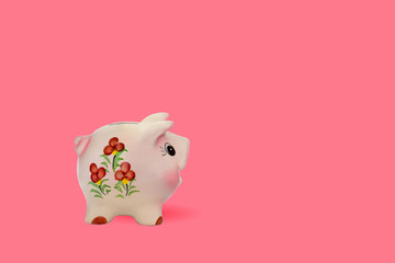Pink watch color piggy bank With a floral pattern on the side view isolated on pink background, with copy space. - Powered by Adobe