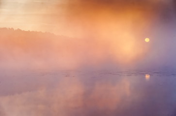 Mist over the lake dawn early morning in the summer