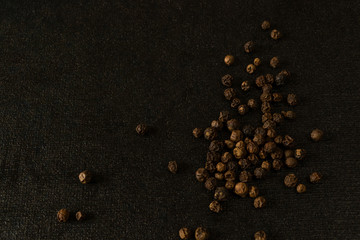 spices, pepper close-up on black background