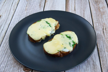 Whole grain bread with egg, herbs and cheese