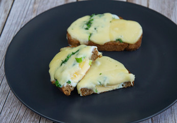 Whole grain bread with egg, herbs and cheese
