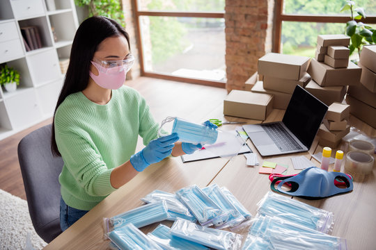 Profile photo of asian lady family business organize order facial flu medical mask sending prepare delivery anti viral safety put respirators into zipper bag stay home office indoors