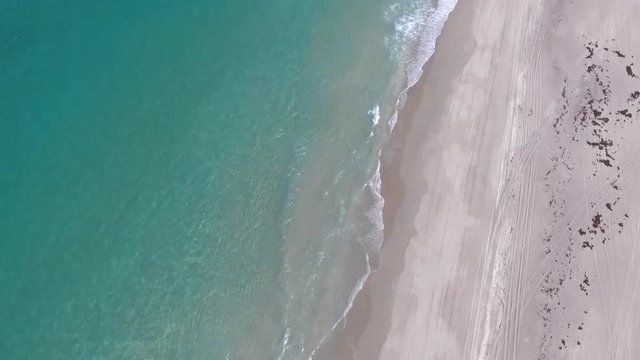 Pier at a local Florida beach on a bright sunny day empty beaches