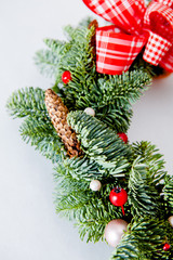 close-up elements of Christmas wreath with red shiny beads with flowers of cotton and slices of dried oranges