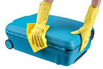 Hands clean suitcase