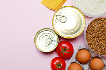 Food donations on a pink background, space for text