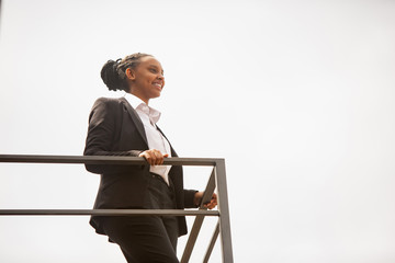 Leader, smiling. African-american businesswoman in office attire smiling, looks confident and happy, busy. Finance, business, equality and human rights concept. Beautiful young model, successful.