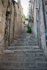 Fototapeta na wymiar Steep stairs and narrow street in old town of Dubrovnik, Croatia