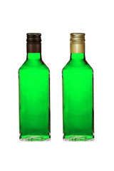 Two bottles with green liquor wih black and golden caps isolated on white