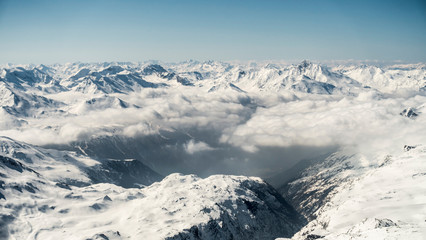 Fototapeta na wymiar Snowy mountains in Alps de Savoie