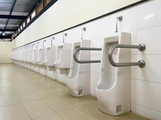 Men's white urinals design, Close up row of outdoor urinals men public toilet, Urinal concept.