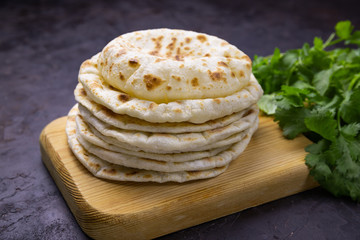 pita breads on a black background