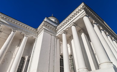 White columns of the Orthodox Church against the blue sky  in summer
