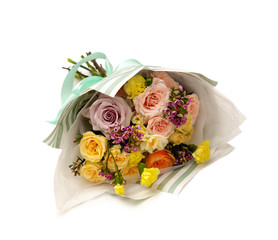 festive bouquet of white and purple roses in craft brown paper on a white background