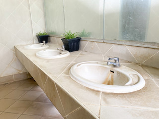 Public sinks, Handwashers for people using public toilets, Public toilets and hygiene concept.