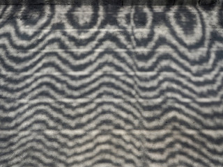 Cement concrete ground floor and shadow of sun shade net.