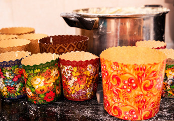 A baking dish for the holiday cupcakes stand on an electric stove