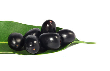 Jambolan plum, ripe fruit or Java plum fresh, placed on green leaves Purple Black Plum, Natural...