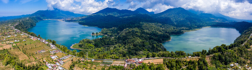 Panoramic aerial view of beautiful twin lakes in an ancient volcanic caldera (Lakes Buyan and Tamblingan, Bali, Indonesia)
