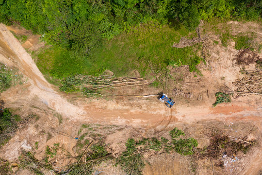 Top down aerial view of deforestation and logging in a tropical rainforest.  Deforestation contributes in a large way to habitat loss and man-made climate change.