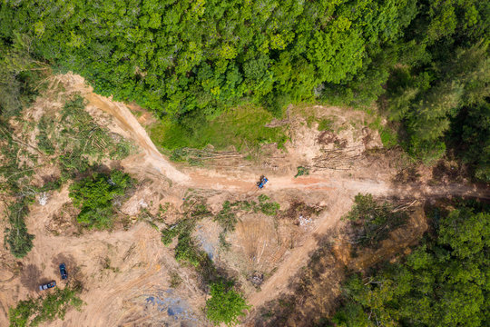 Top down aerial view of deforestation and logging in a tropical rainforest.  Deforestation contributes in a large way to habitat loss and man-made climate change.