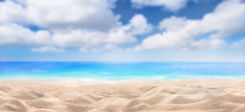 A summer vacation, holiday background of a tropical beach and blue sea and white fluffy clouds. © Duncan Andison