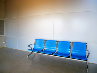Blues waiting row chair on concrete polishing floor and grey aluminium composite wall back ground....
