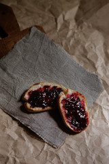 bread with jam on a brown background. homemade jam. recipe