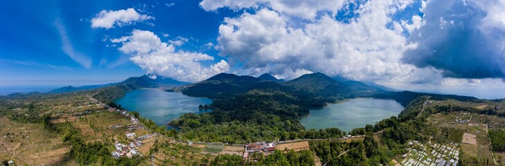 Panoramic aerial view of beautiful twin lakes in an ancient volcanic caldera (Lakes Buyan and Tamblingan, Bali, Indonesia)