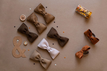 Children's hair ornaments in brown tones on a brown background, hair clips and headbands for little girls on a brown background