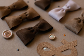 Children's hair ornaments in brown tones on a brown background, hair clips and headbands for little girls on a brown background
