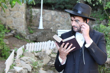 Jewish man examining a book 