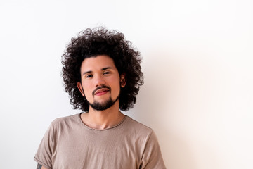 Latin American man smiling, neutral background 