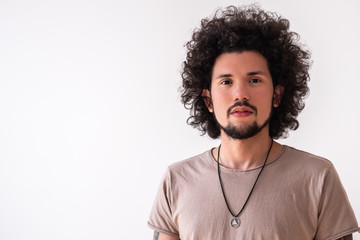 Latin American model slightly smiling, headshot, neutral background 