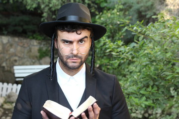 Skeptical Jewish man raising eyebrow 