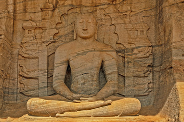 Buddha statue in granite rock at Polonnaruwa, Sri Lanka. Gal Viharaya Buddhist temple.