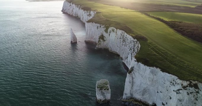 Aerial descending movement shows Old Harry Rocks formations in England, UK 