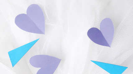 valentine paper heart on white textile                  
