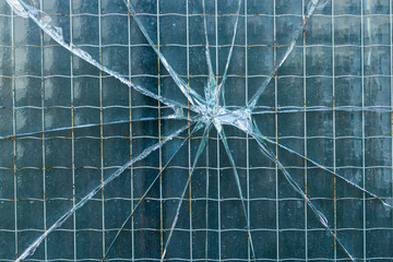 Cracked window of an industrial building (detail)
