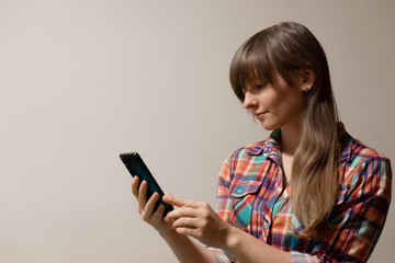 Fototapeta premium young woman using smartphone