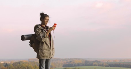 Hiker Woman taking photo smartphone