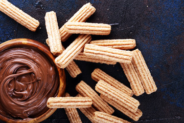 Traditional Spanish dessert churros with sugar and sweet chocolate