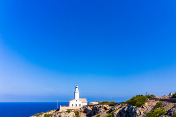 Fototapeta na wymiar Aerial view lighthouse Far de Capdepera with cliffs, Cala Ratjada, Mallorca, Balearic Islands, Spain