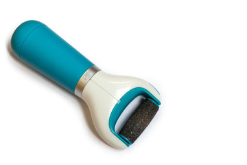 Care and cleansing of the feet from rough, flaky skin. Electric sander with replaceable diamond pedicure attachment at home, isolated on a white background close-up.