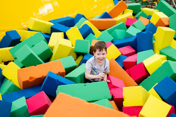 little boy playing with toy blocks