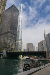 Modern buildings and Marina City Towers near Chicago river.