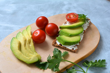 Vegetables tomatoes, avocado and greens for sandwiches