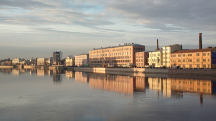 Fototapeta premium view of the neva river and st petersburg at sunset