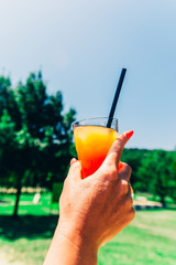 yellow cocktail at the beach